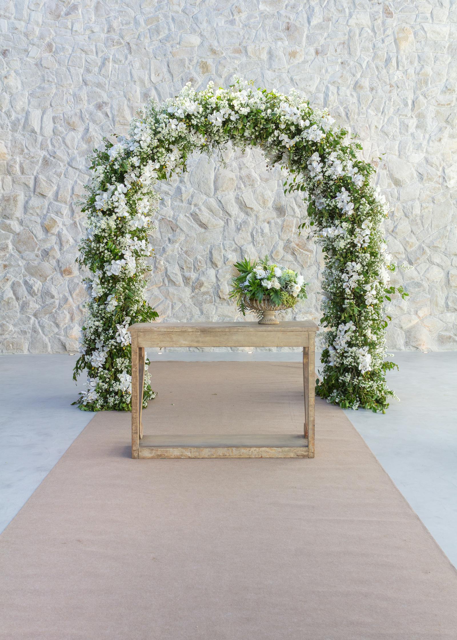Wedding ceremony detail with floral arch